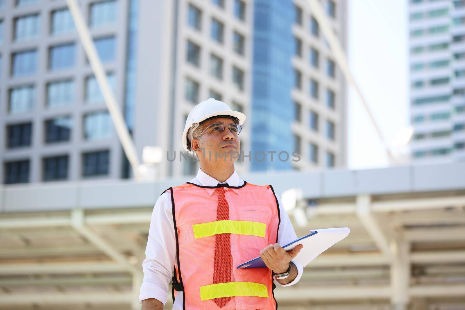 Construction engineers discussion with architects at construction site or building site