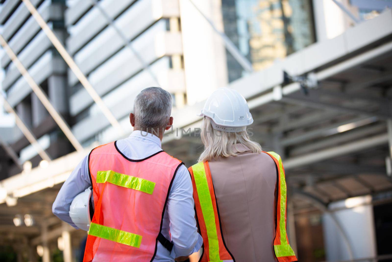 Engineering civil, Construction engineers discussion with architects at construction site or building site of high-rise building with Surveying for making contour plans by chuanchai