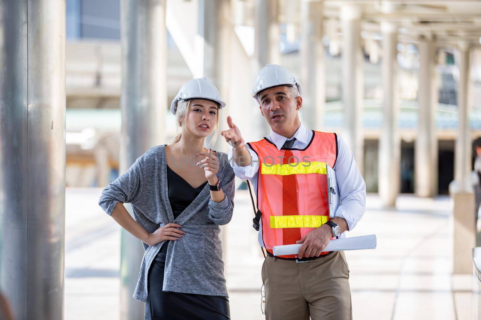 Engineering civil, Construction engineers discussion with architects at construction site or building site of high-rise building with Surveying for making contour plans by chuanchai