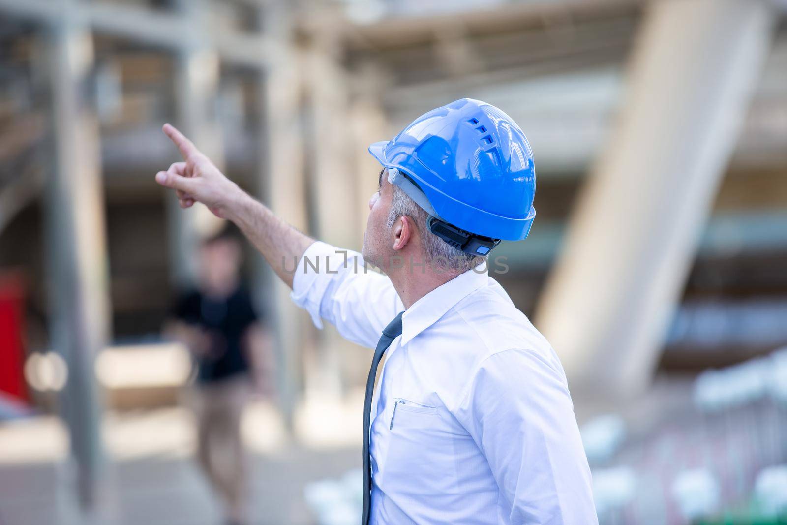 Construction engineers discussion with architects at construction site or building site