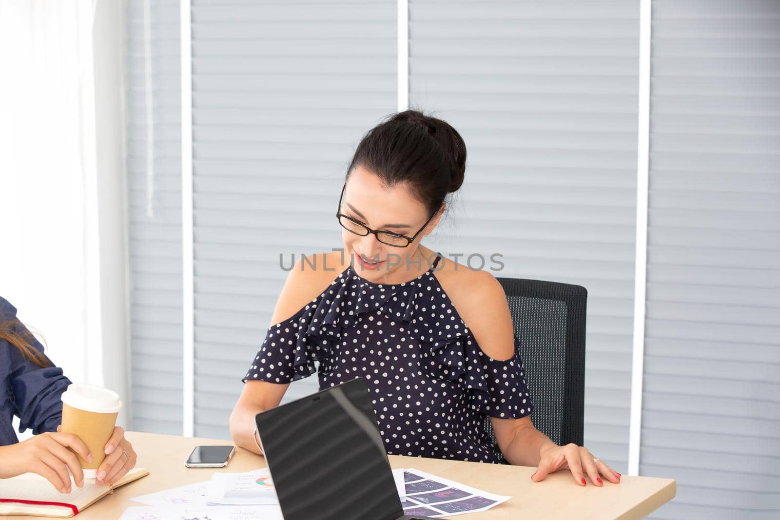 Business people working in office on desktop computer, Group of happy business people in smart casual wear looking at the laptop and gesturing. Achieving success. by chuanchai