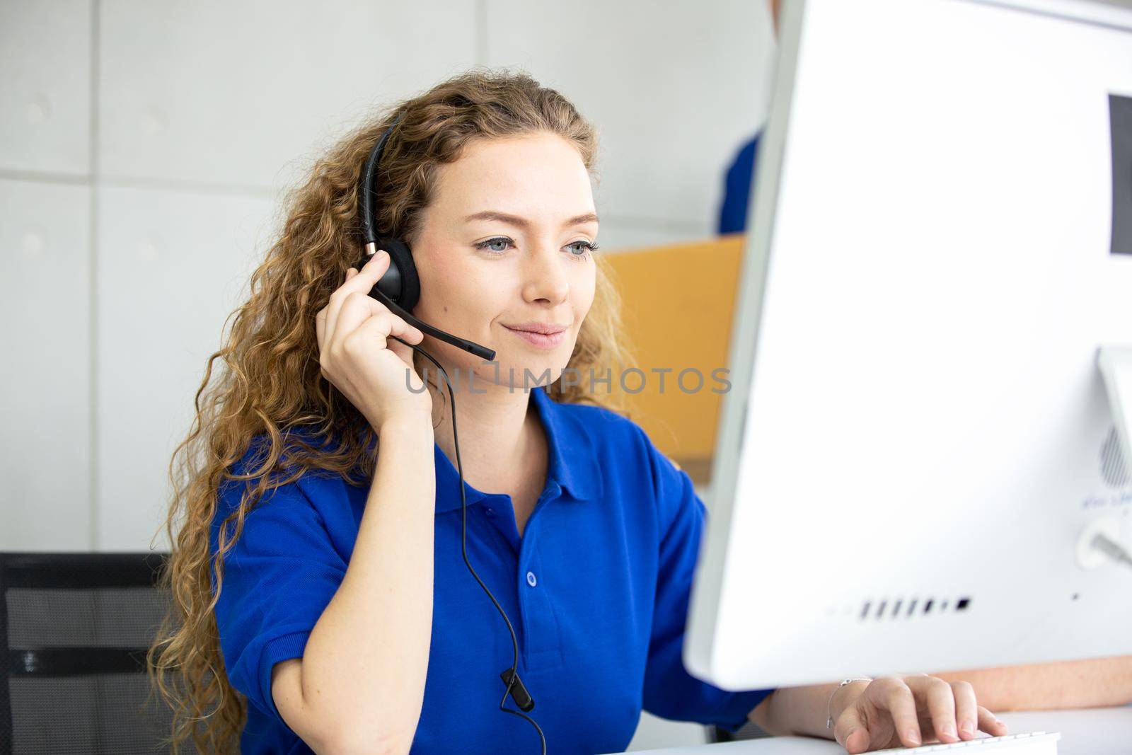 Call center operator in headset while consulting client. Telemarketing or phone sales. Customer service and business concept.