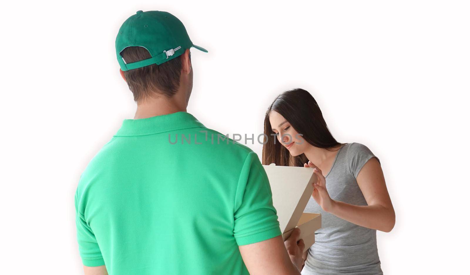 Close up young woman receiving package box from postman in front of house after check order from internet , delivery transport and online shop concept