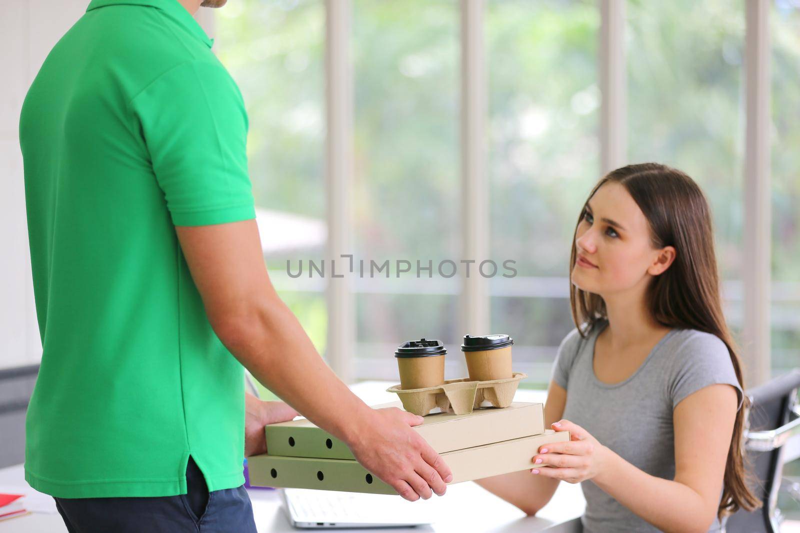 women take delivery box from deliveryman