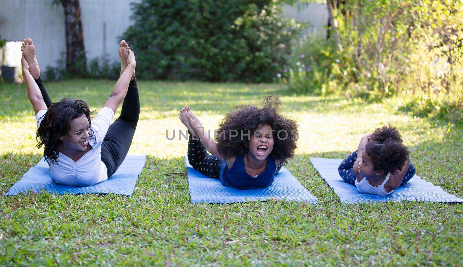 Mix race of family, dad, mom and daughters play together in living room by chuanchai