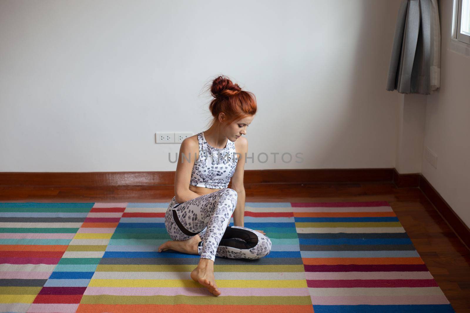 Women practice yoga at home