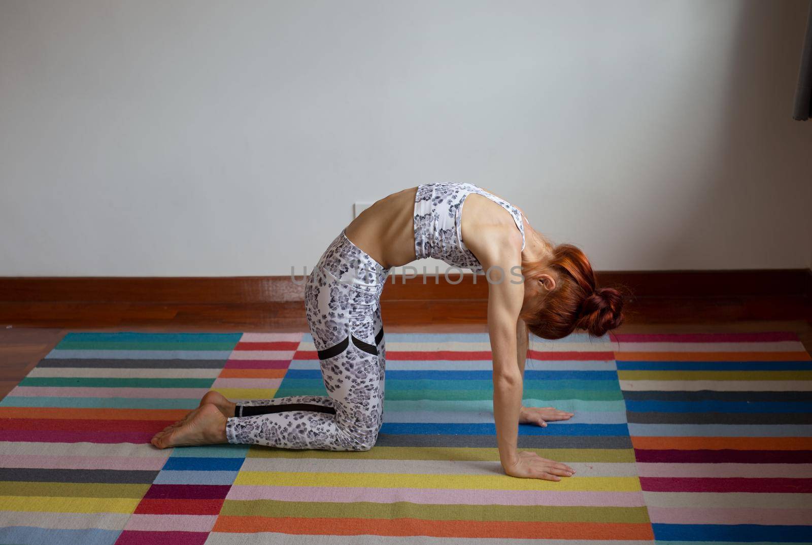 Women practice yoga at home