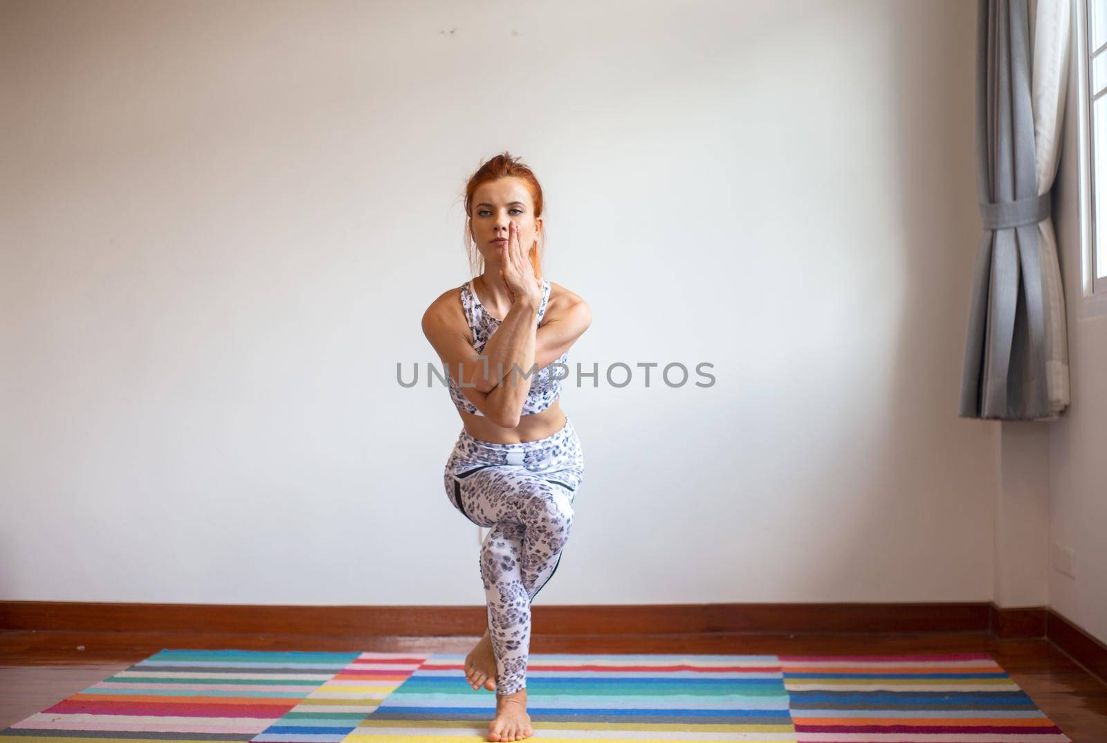 Women practice yoga at home by chuanchai