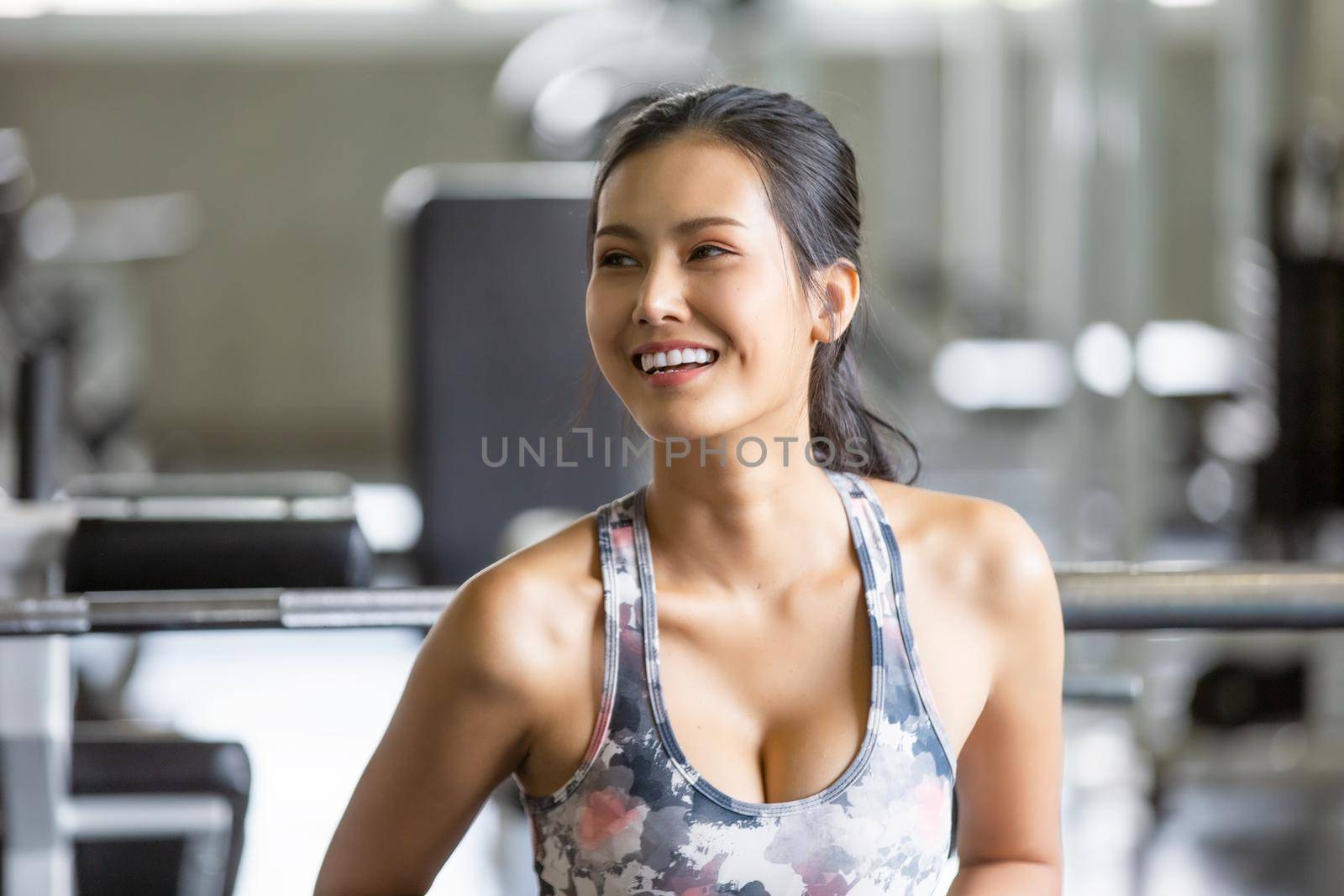 Athletic young people in sportswear doing fitness stretching exercises at fitness gym. Sport and recreation concept. by chuanchai