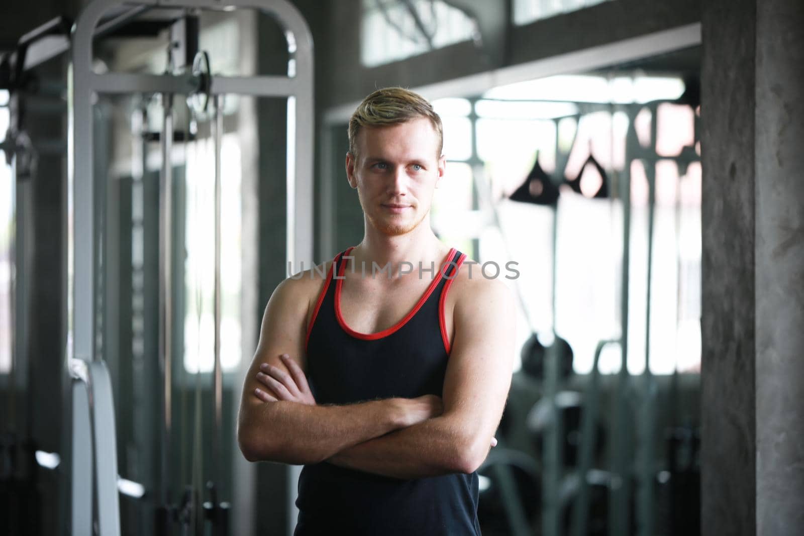 sport, fitness, lifestyle and people concept - group of men flexing muscles with dumbbells in gym by chuanchai