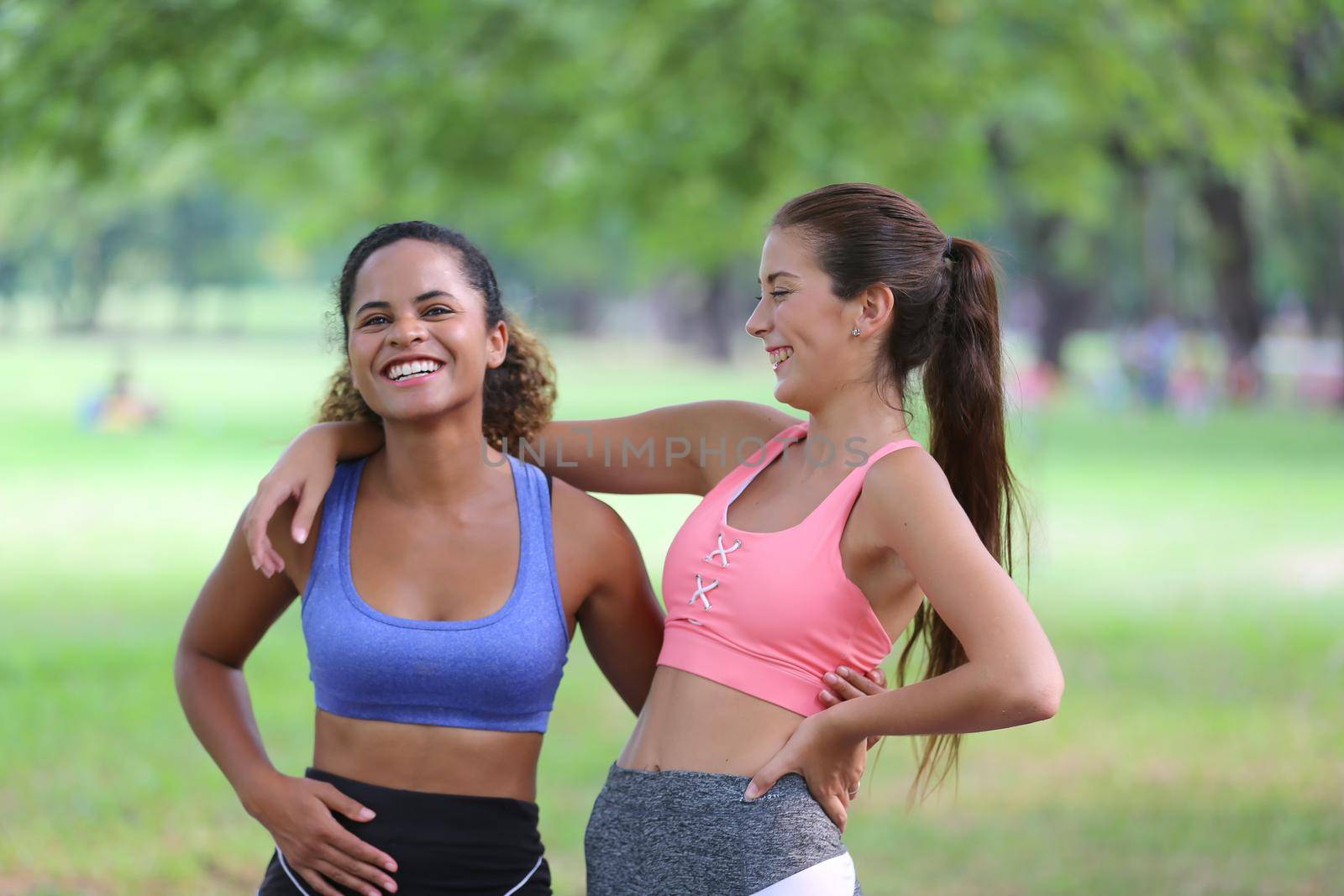 Athletic young people in sportswear doing fitness stretching exercises at fitness gym. Sport and recreation concept. by chuanchai