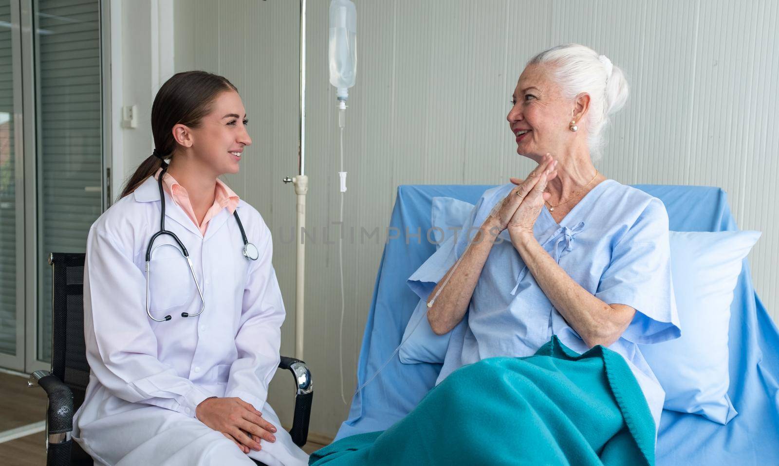 Femen doctor and elderly patient, Female doctor doing medical exam to a senior woman 