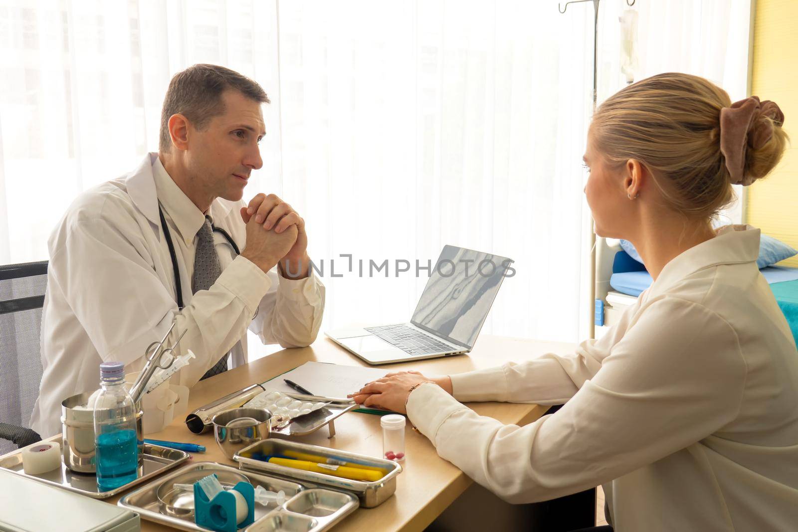 Doctor check up and discuss with patient in clinic or doctor talk with women patient in hospital