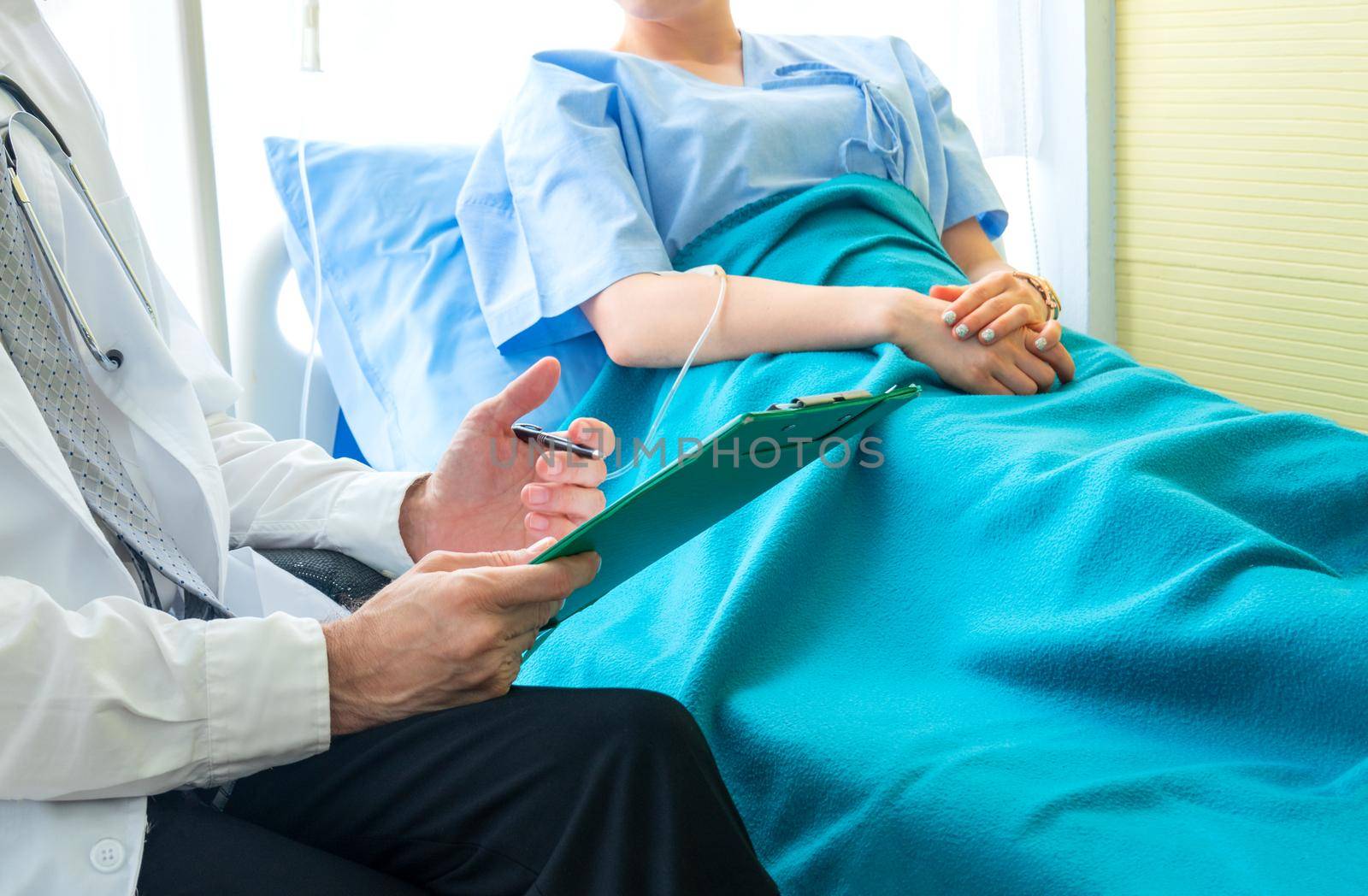 Doctor check up and discuss with patient in clinic or doctor talk with women patient in hospital