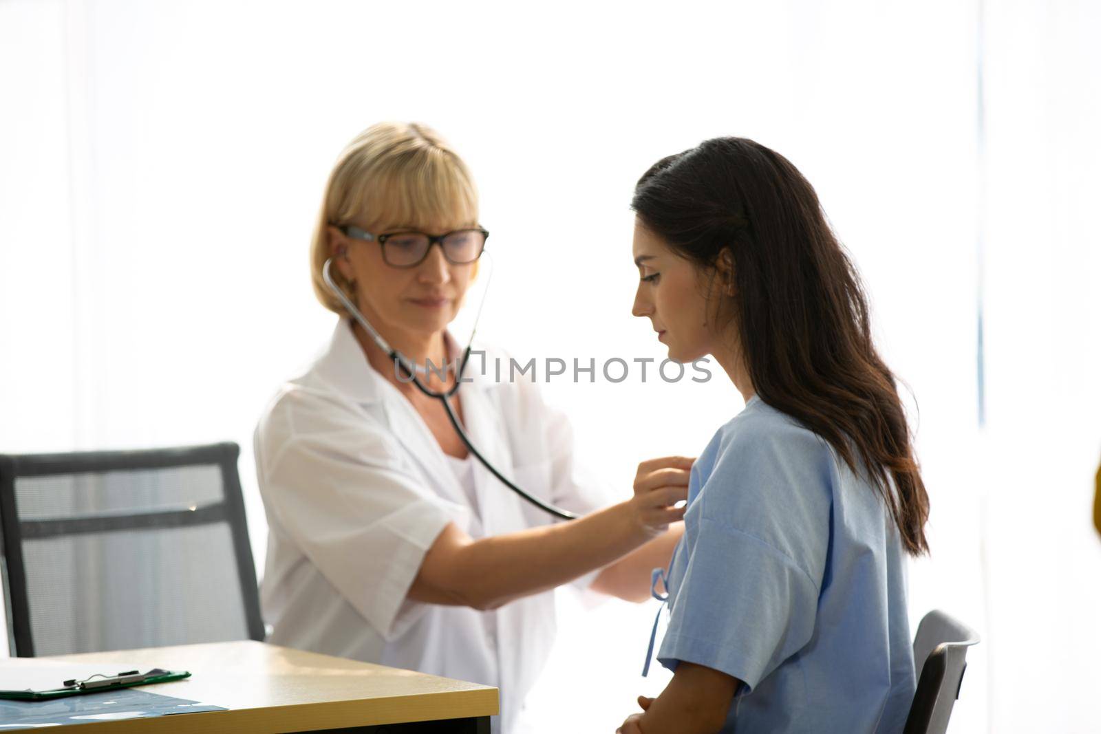 Doctor check up and discuss with patient in clinic or doctor talk with women patient in hospital