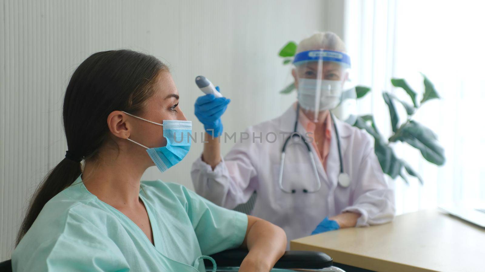 Coronavirus protection during the quarantine, Female doctor doing medical exam to a women patient.