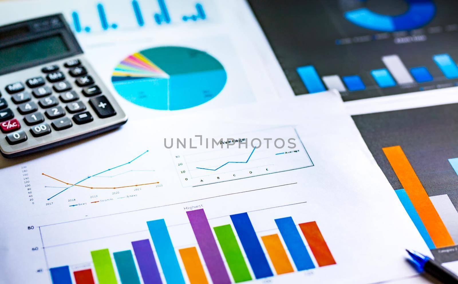 Financial analysis sheet data with pen and calculator. Accounting financial and marketing concept.