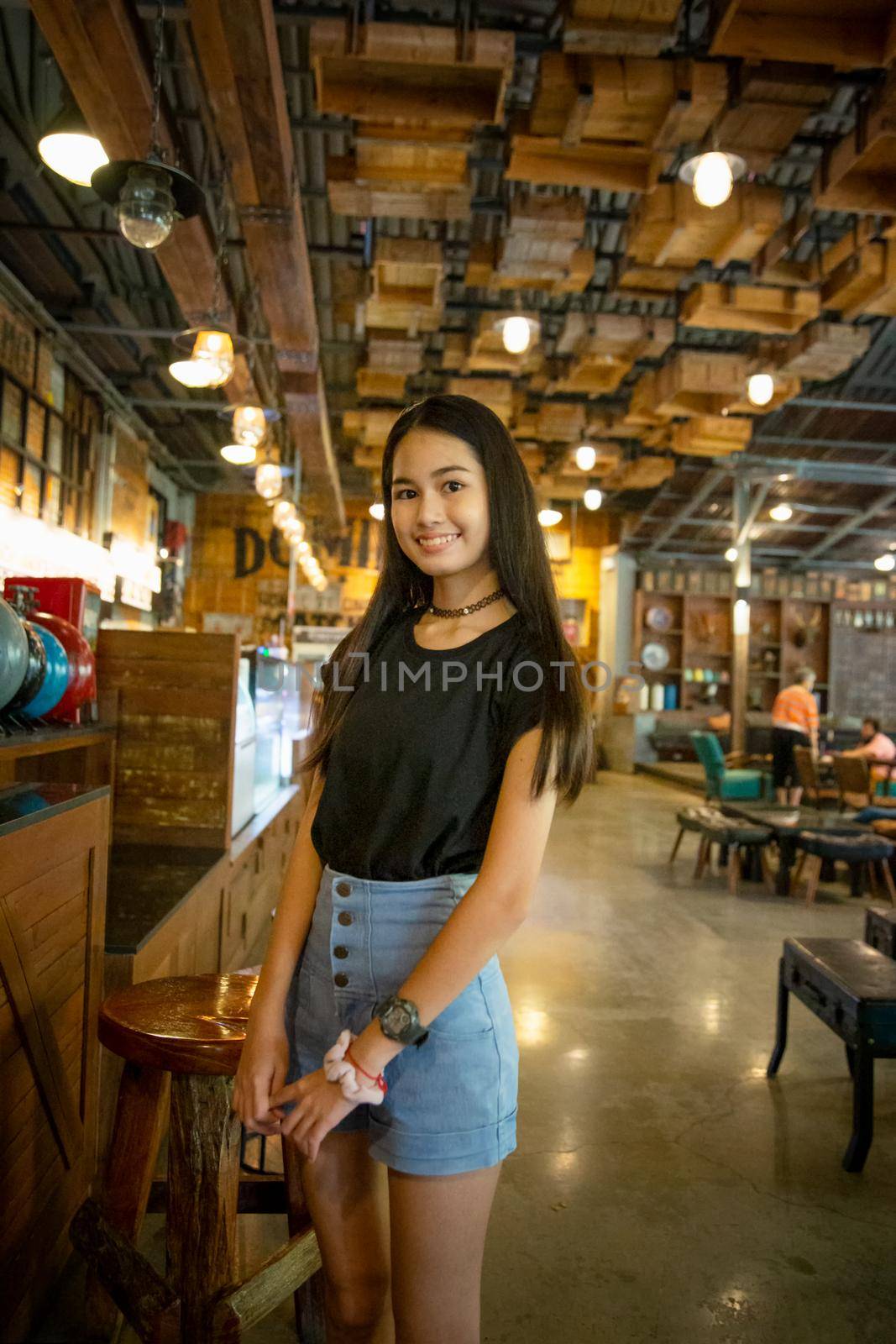 portrait of young charming beautiful girl with smile, authentic moments of real emotion. by chuanchai