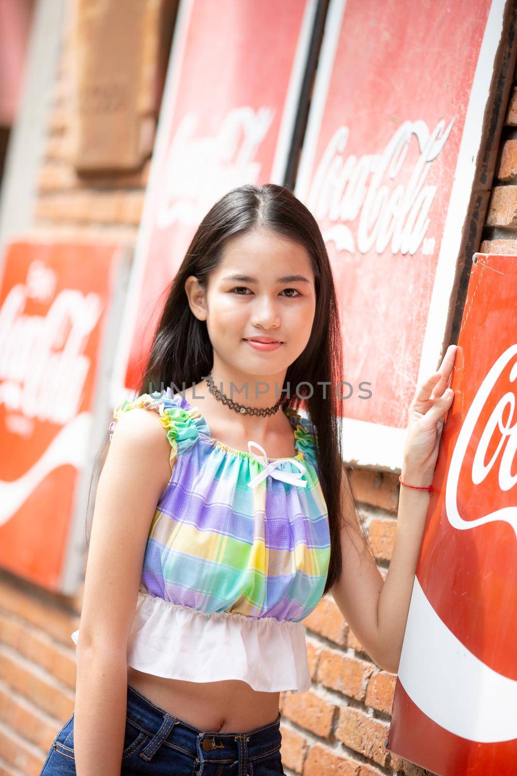 portrait of young charming beautiful girl with smile, authentic moments of real emotion. by chuanchai