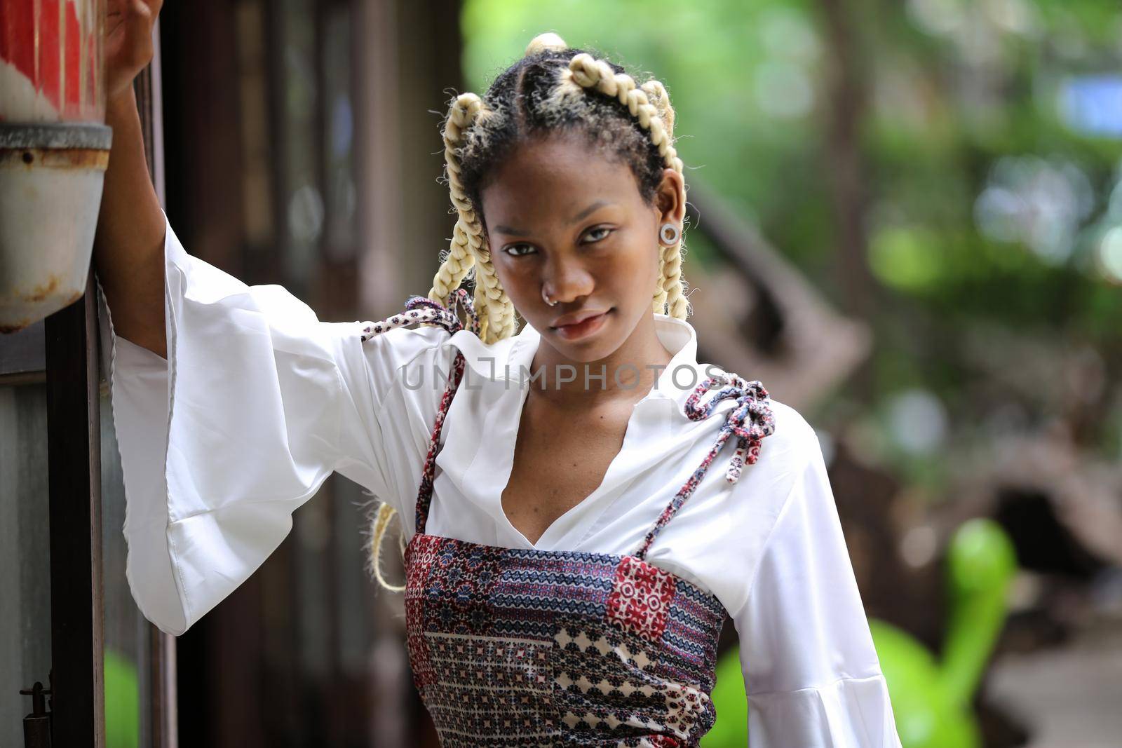 Outdoor Portrait Of African American Young Woman by chuanchai