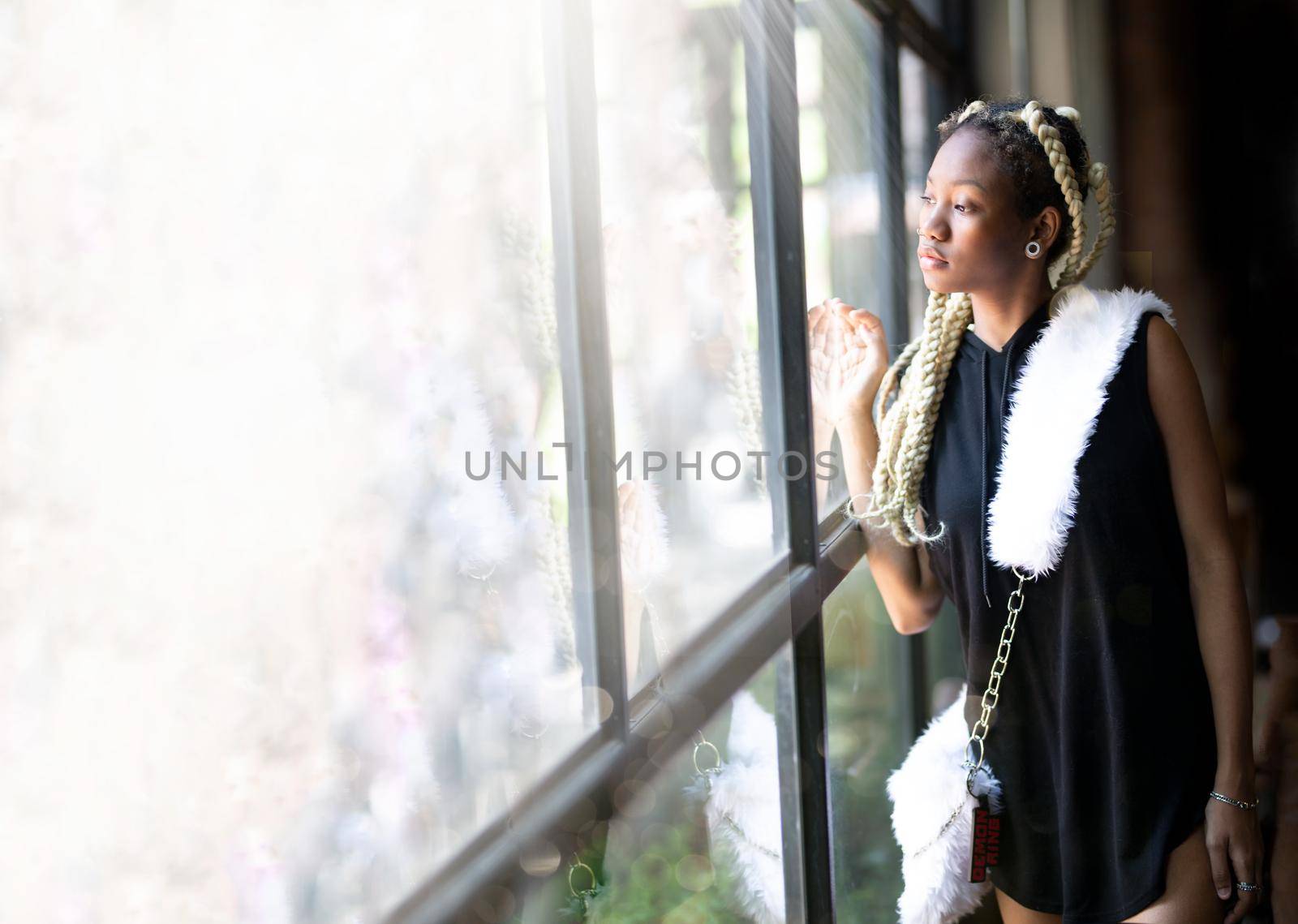 Outdoor Portrait Of African American Young Woman by chuanchai