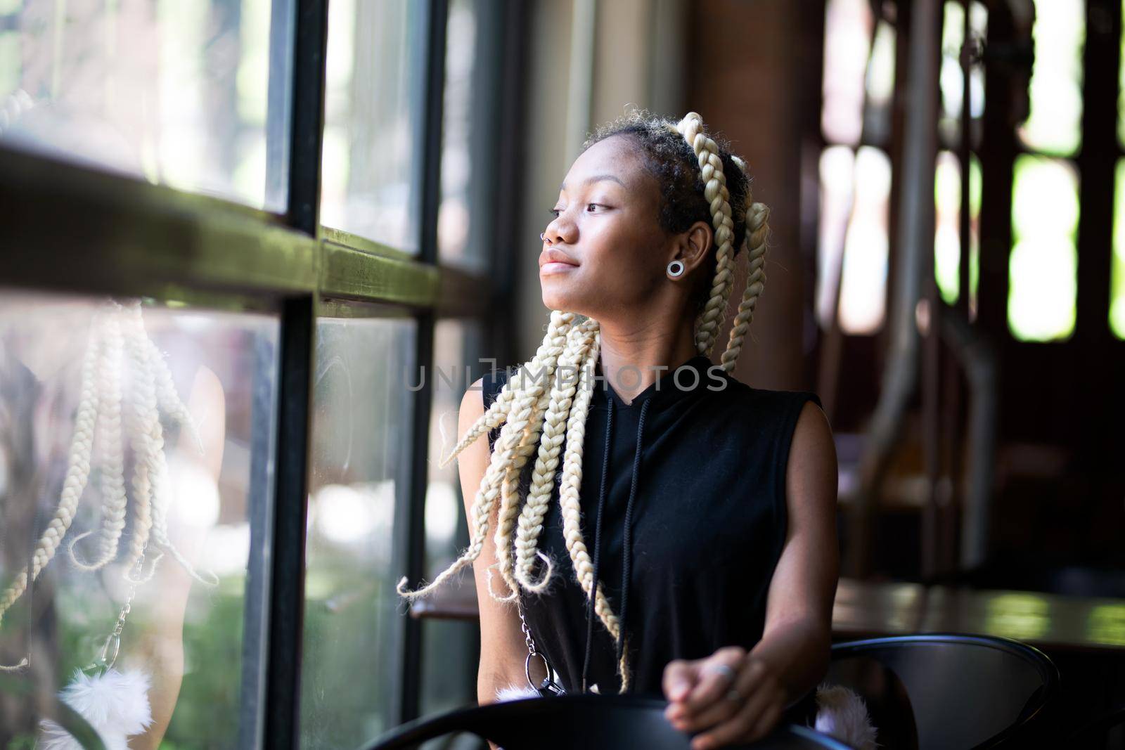 Outdoor Portrait Of African American Young Woman by chuanchai