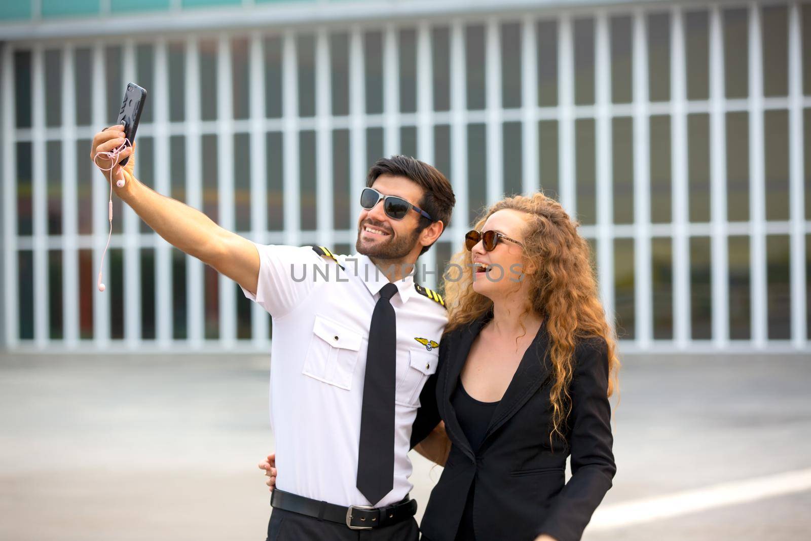 Shot of a mature Helicopter pilot using a headset while traveling in a helicopter, Business people traveling by helicopter