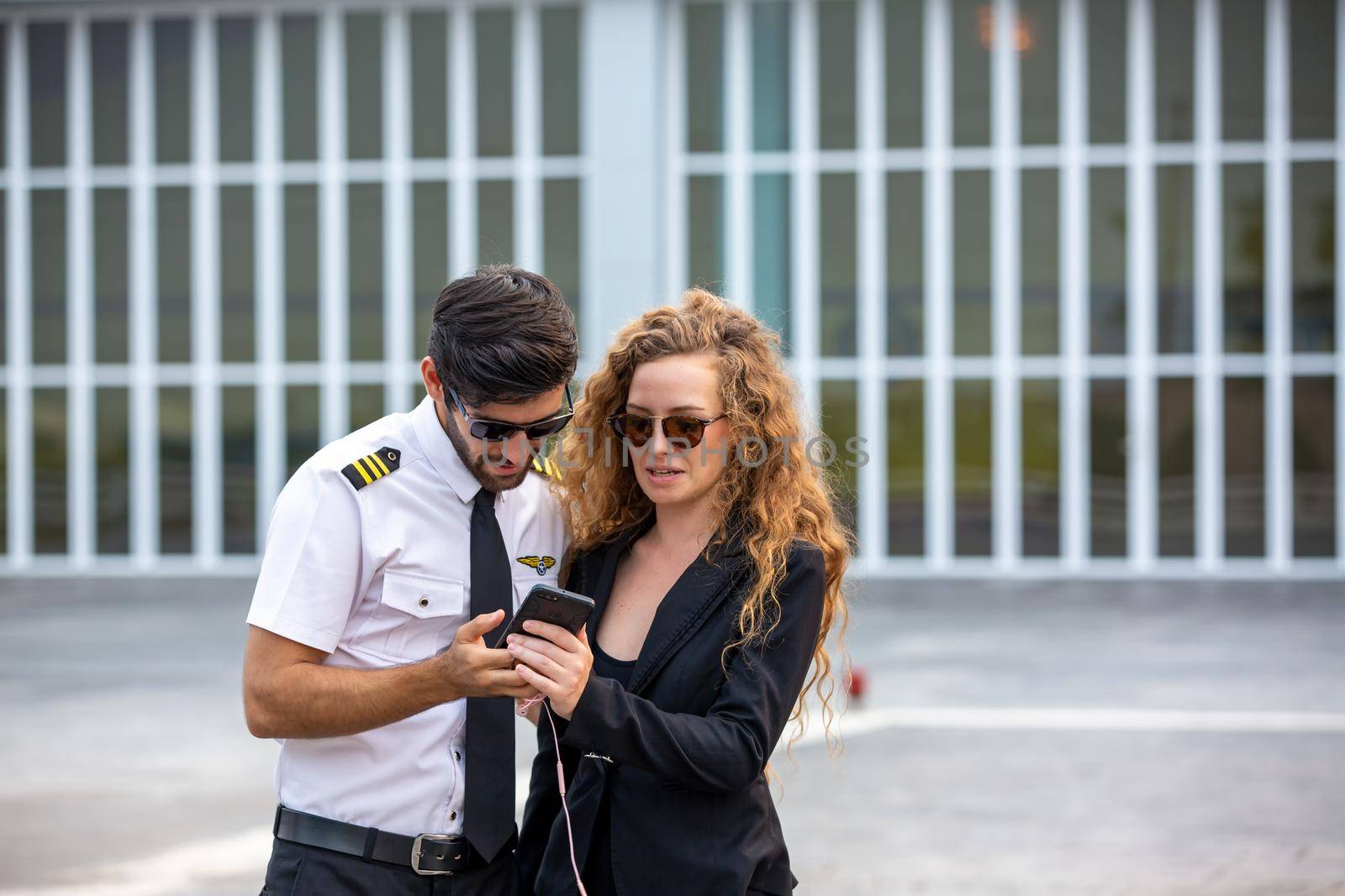 Shot of a mature Helicopter pilot using a headset while traveling in a helicopter, Business people traveling by helicopter