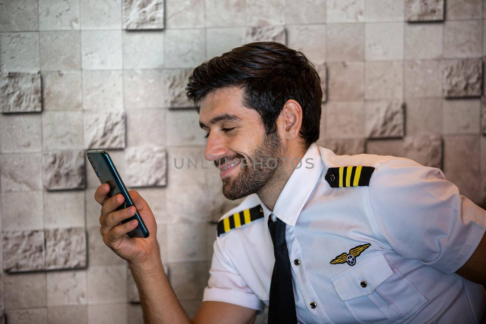 Shot of a mature Helicopter pilot using a headset while traveling in a helicopter, Business people traveling by helicopter