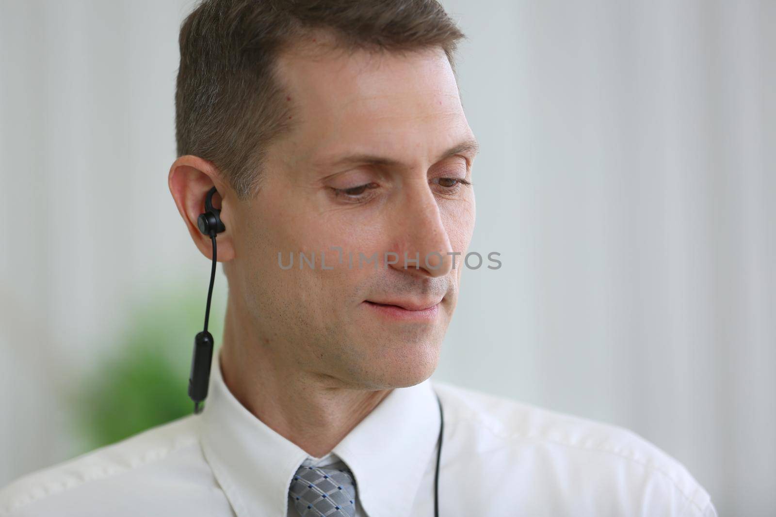  portrait of businessman with earphone