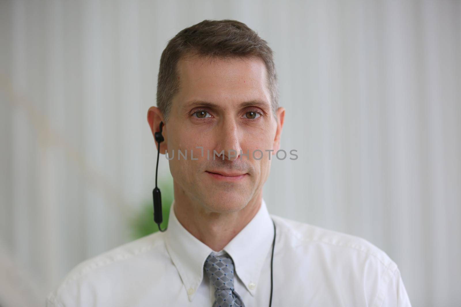  portrait of businessman with earphone