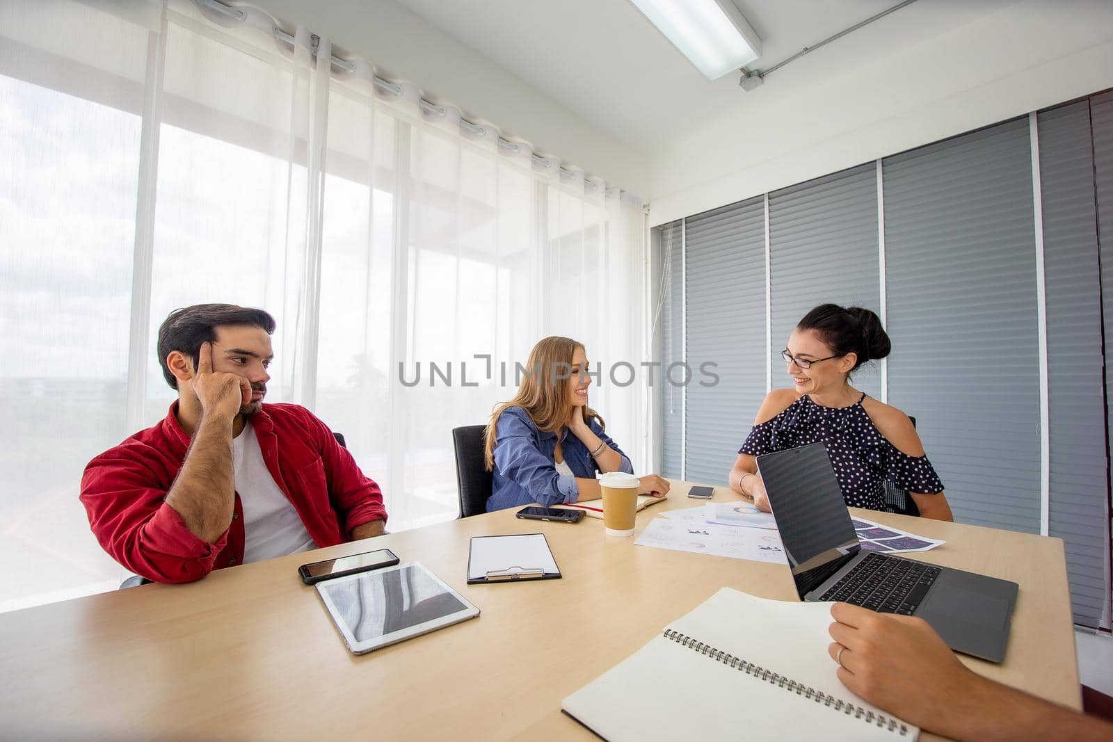 Business people working in office on desktop computer, Group of happy business people in smart casual wear looking at the laptop and gesturing. Achieving success. by chuanchai