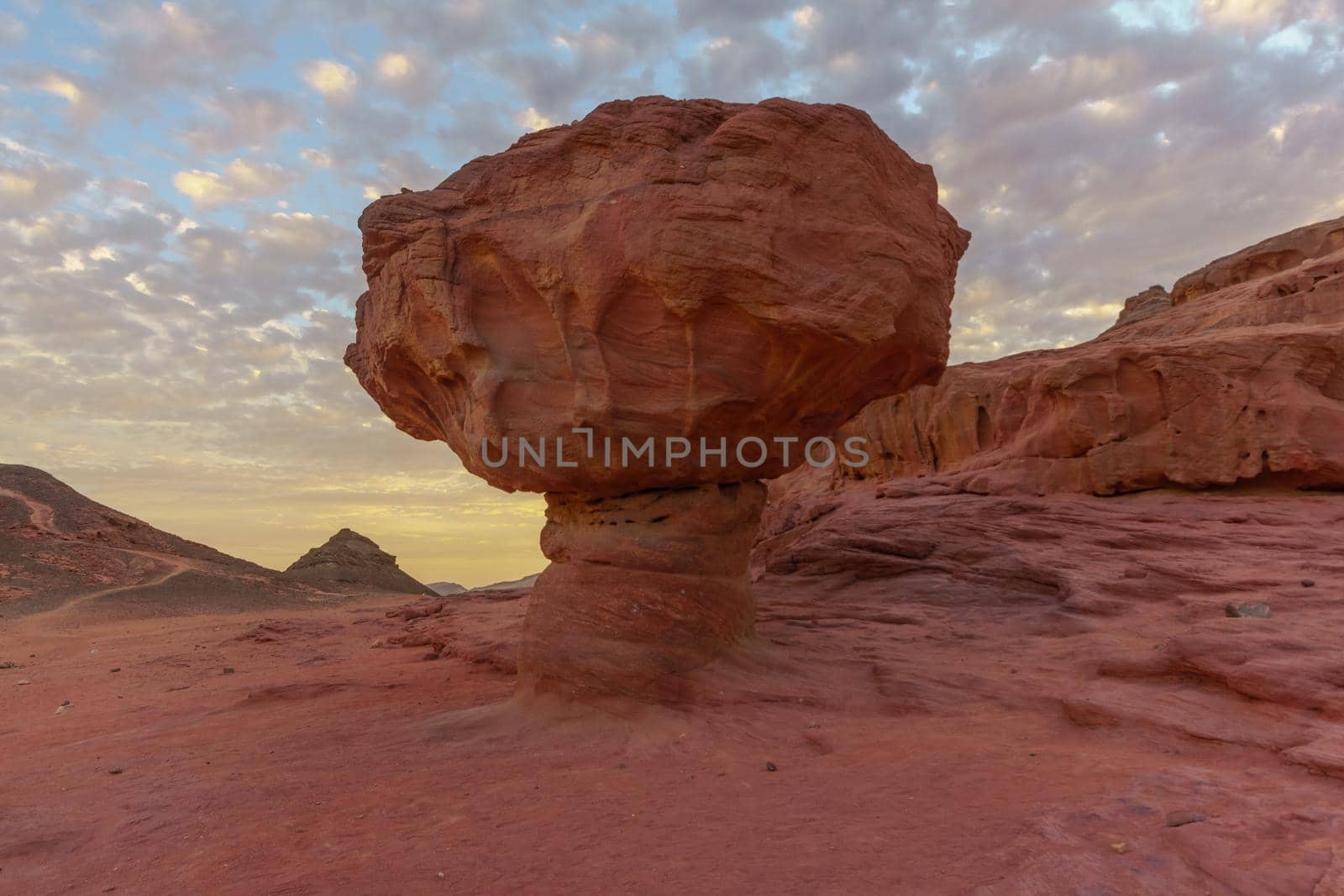 Sunset view of landscape and the Mushroom rock formation, in the Timna Valley, Arava desert, southern Israel