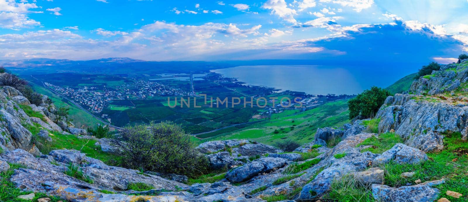 Panoramic morning view of the north part of the Sea of Galilee, and the village Migdal, from mount Arbel. Northern Israel