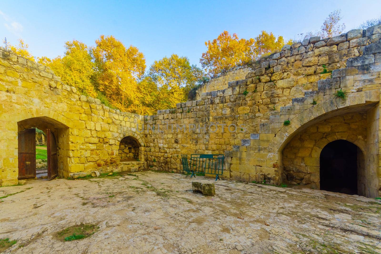 View of a Crusader farmhouse, with trees, and fall foliage in En Hemed National Park (Aqua Bella), west of Jerusalem, Israel