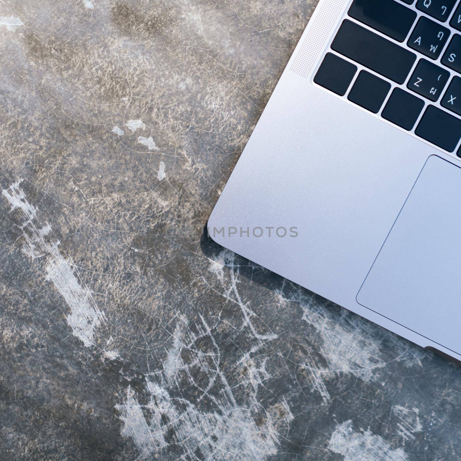 Top view of modern laptop or notebook with phone to work. Office desktop on table background.