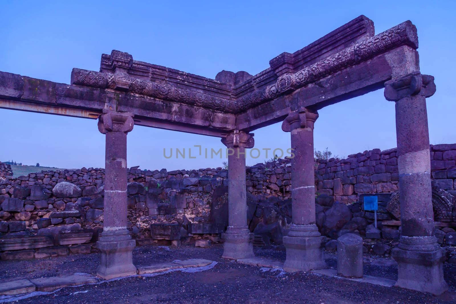 Blue hour (before sunrise) view of the remains of the synagogue of Chorazin (Korazim). Now a National Park in Northern Israel. According to Christian tradition, Jesus preached here and later cursed