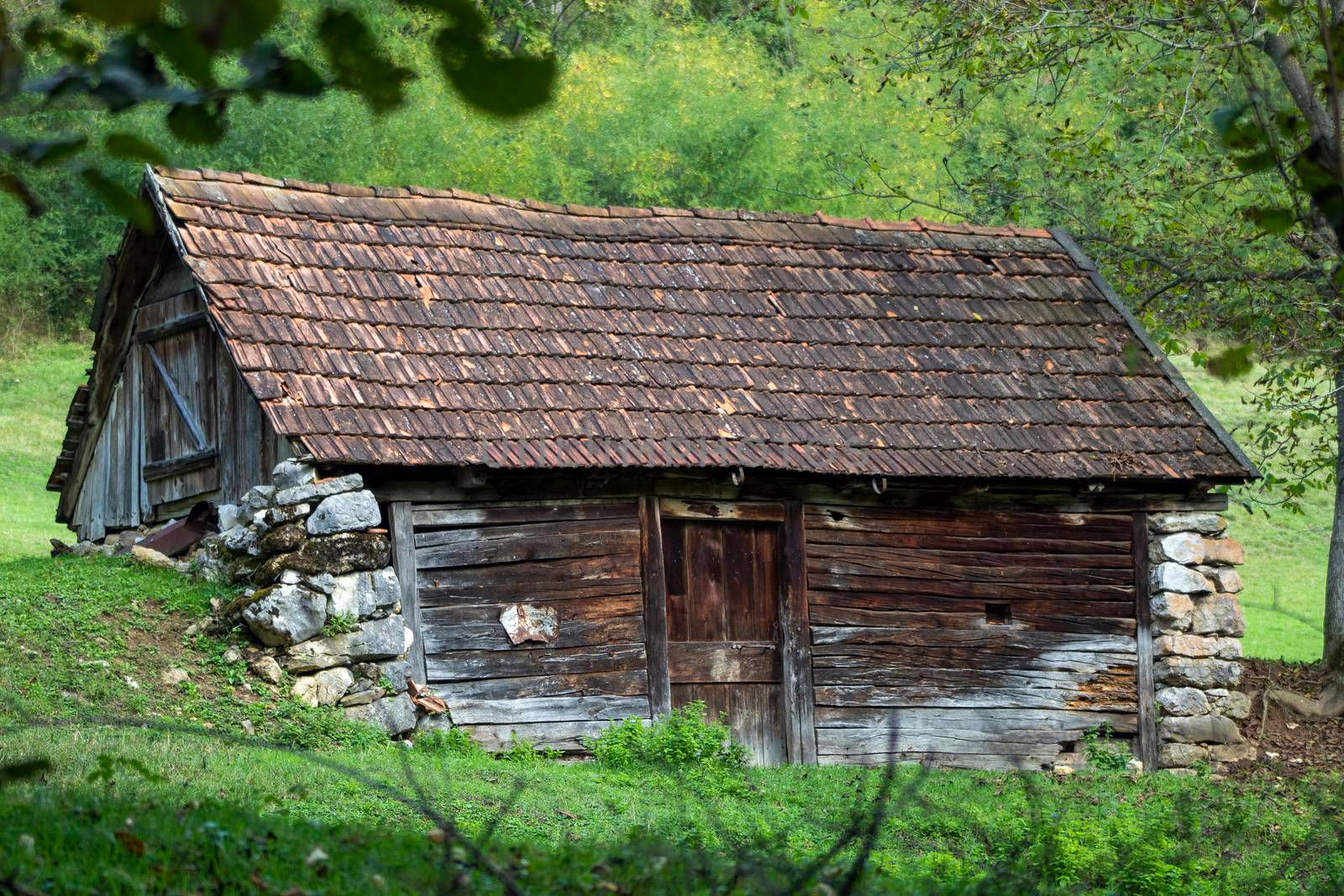 A mountain house surrounded by greenery by bybyphotography