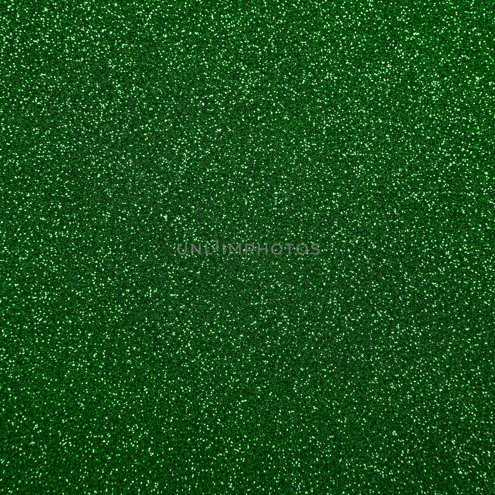 Abstract background texture of shiny colorful vivid dark green glitter noise pattern
