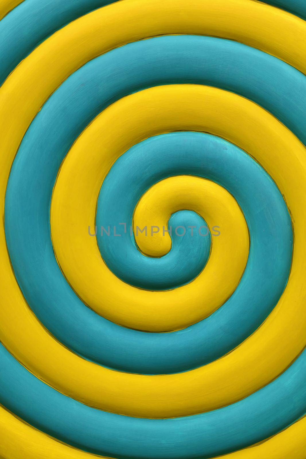 Close up abstract multicolor background of yellow and teal blue spiral
