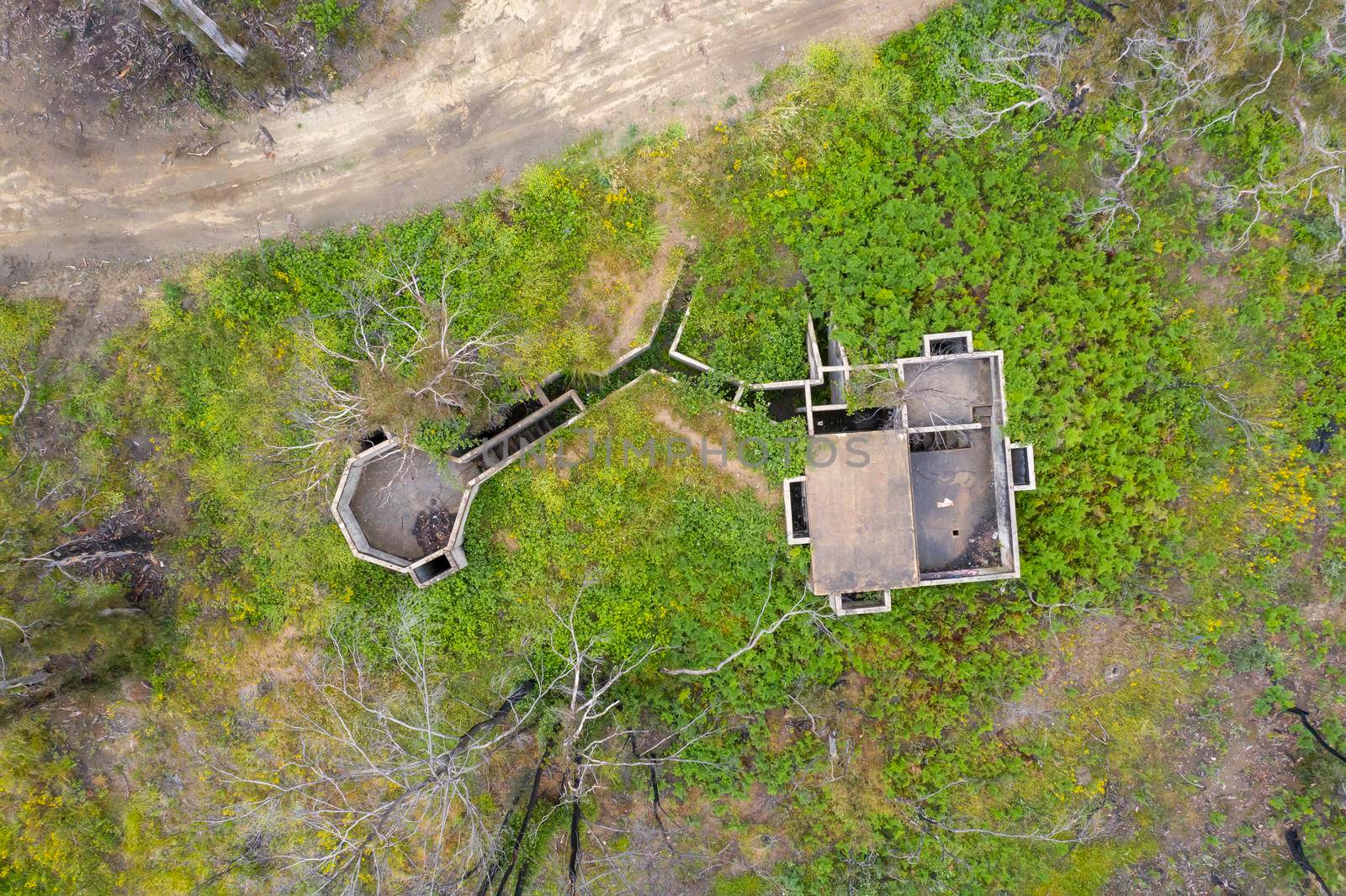 Aerial photograph of structural ruins and forest regeneration after bushfires near Clarence in the Central Tablelands in regional New South Wales in Australia