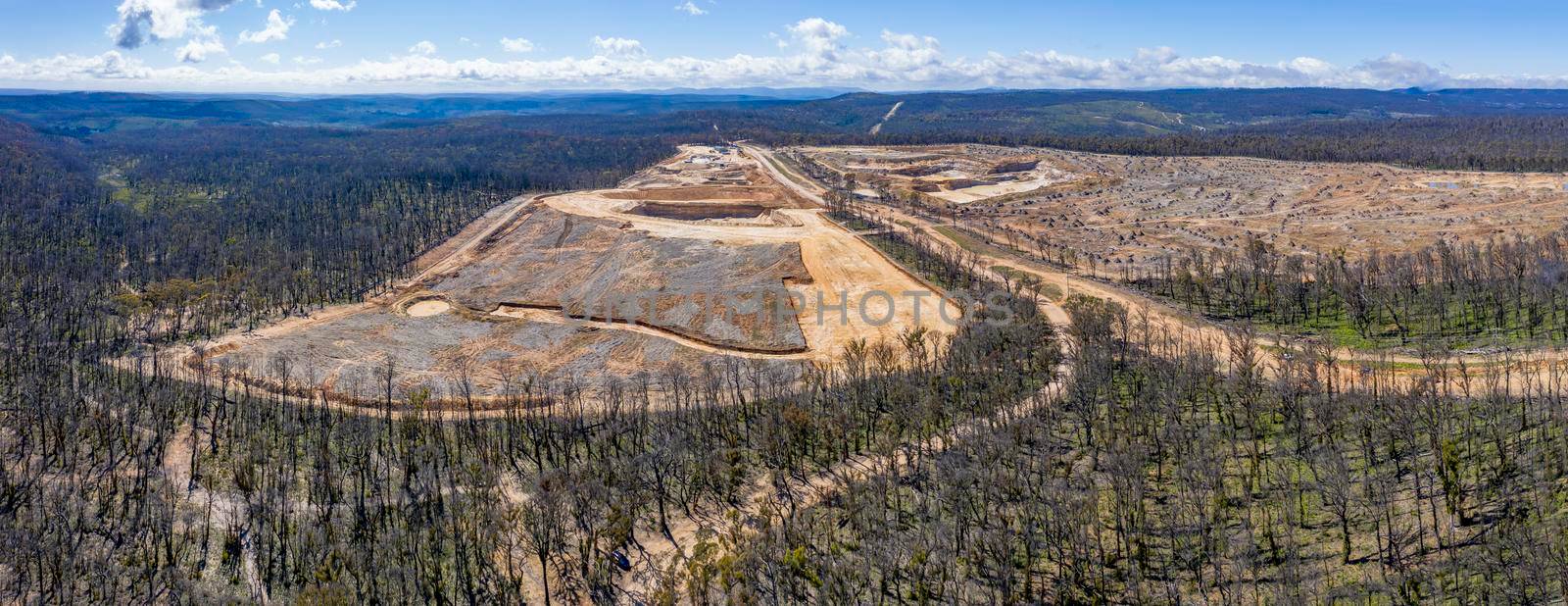 Aerial view of forest regeneration after bushfires and a new Quarry being built in regional Australia