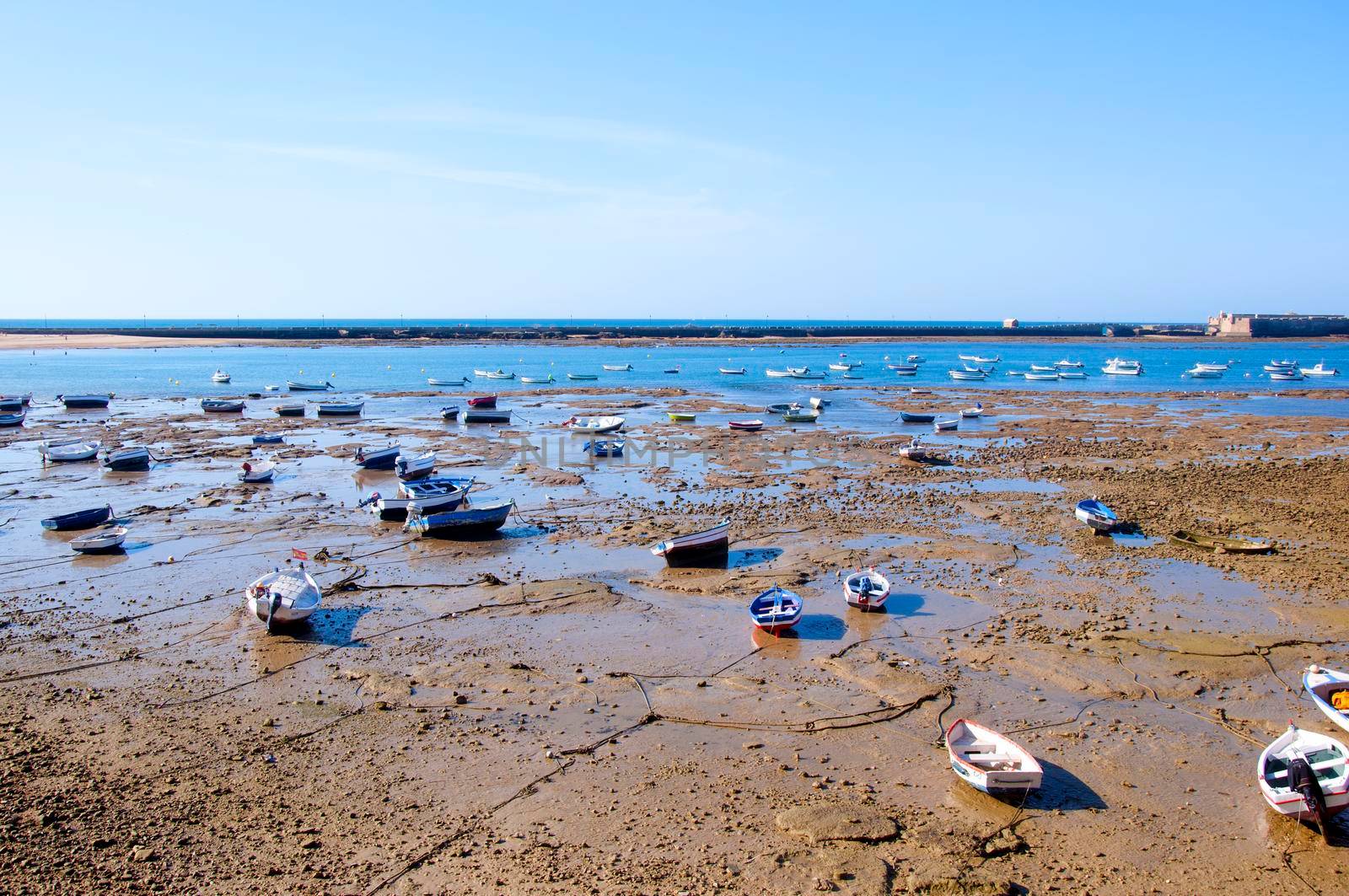 Beach full of small boats, low water by Bezdnatm