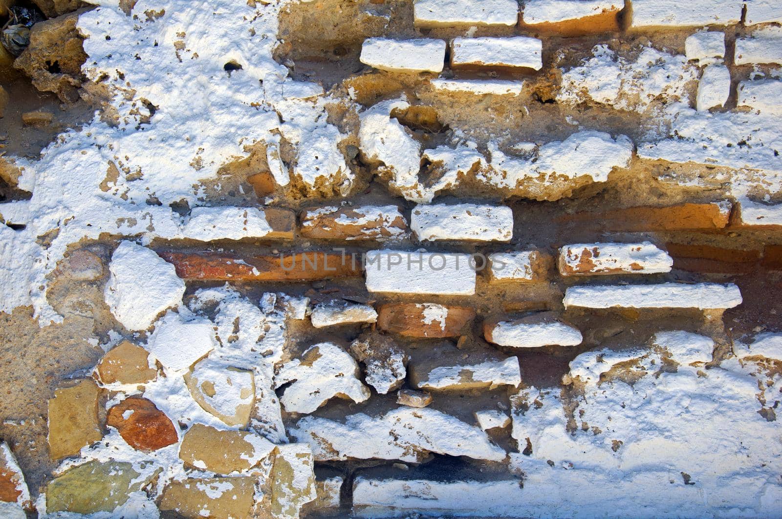 White brick wall with different textured surface