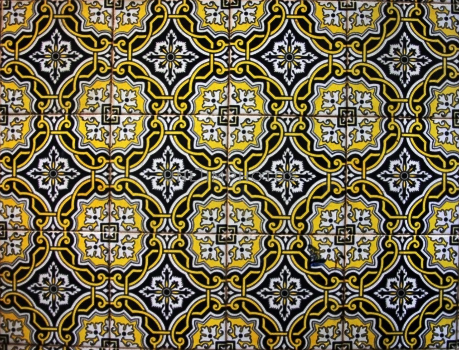 Black, blue, yellow and white colored portuguese tile from Tavira, Portugal