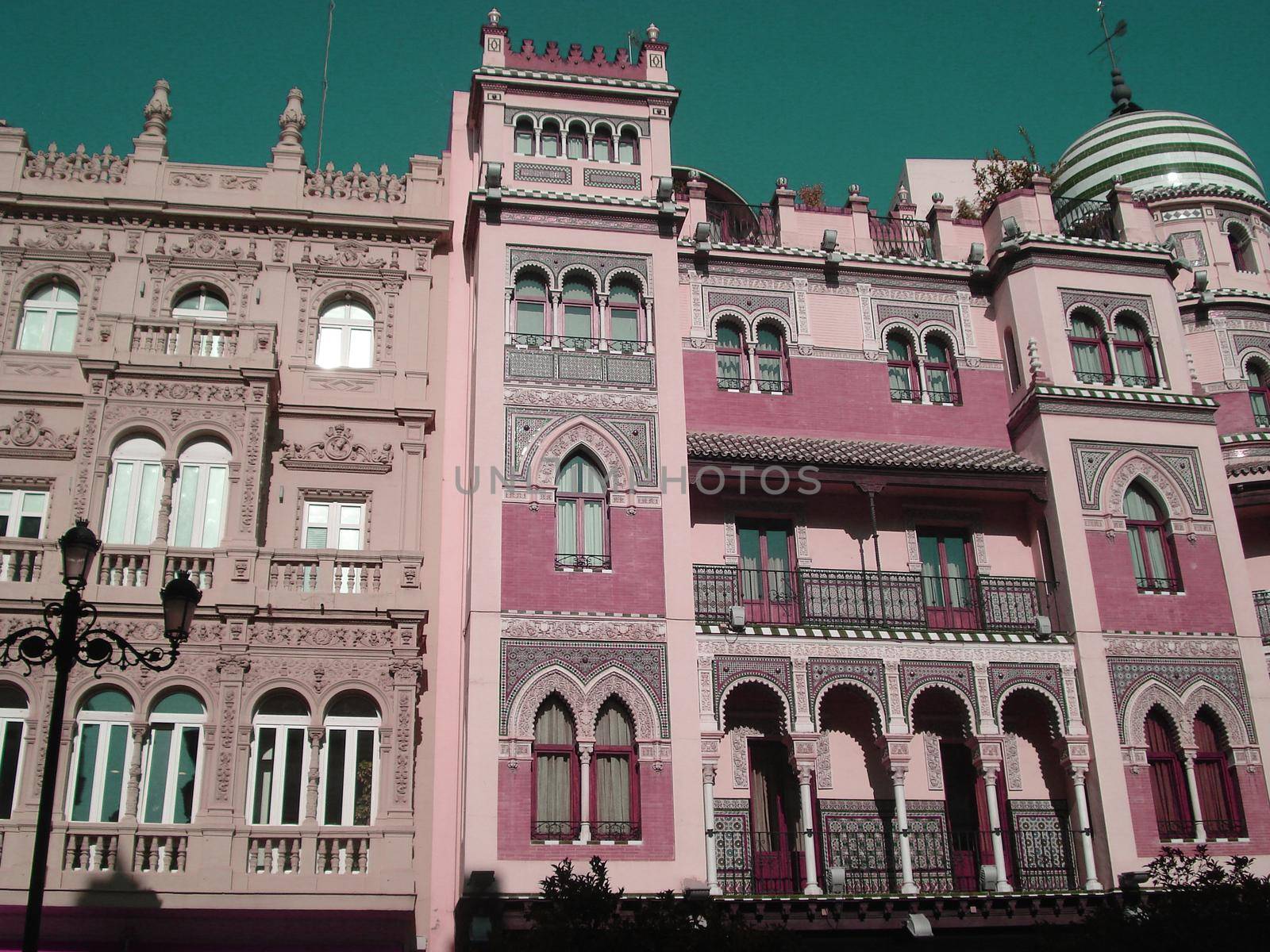 Historical pink building in arabic style in Seville, Spain