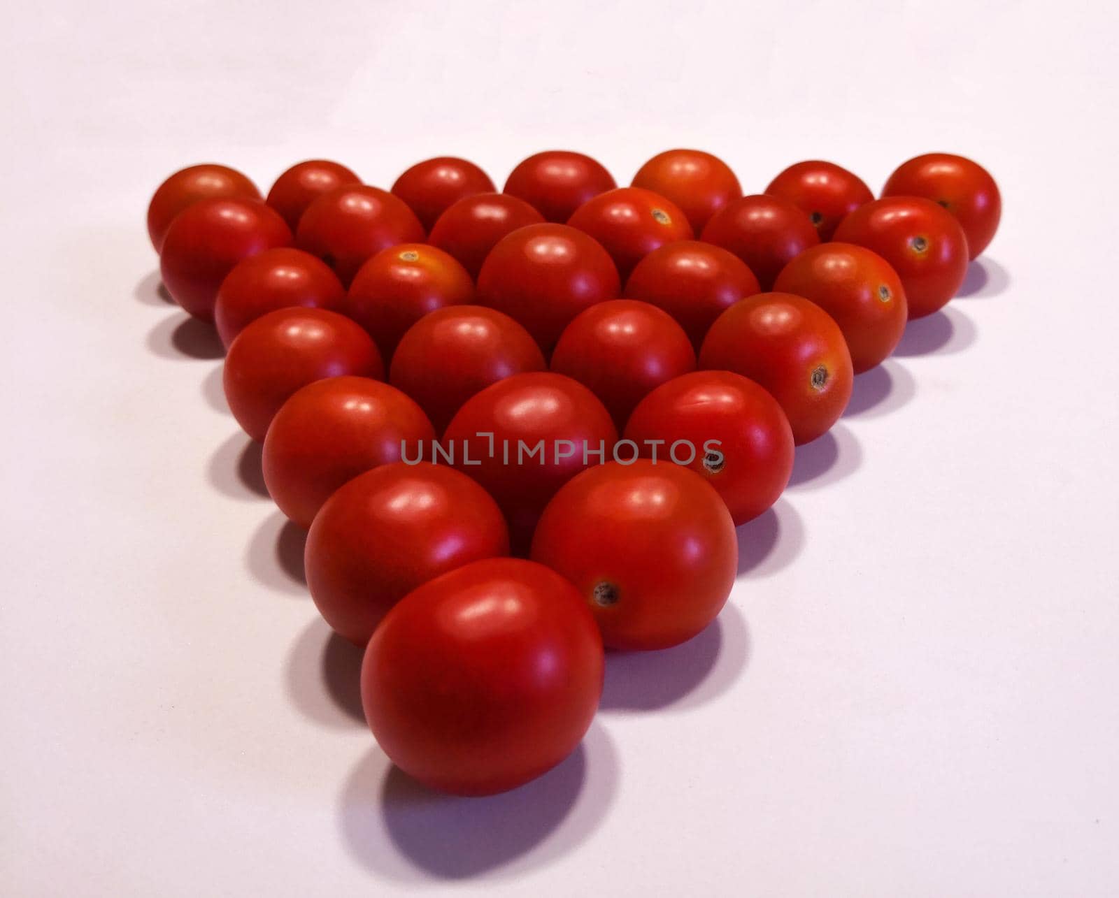 Red cherry tomatoes, close up, isolated