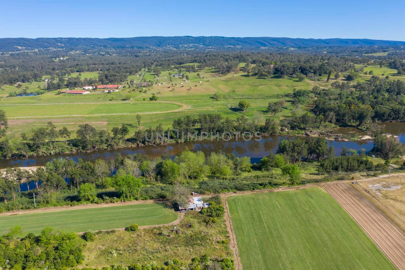 Aerial view of the Hawkesbury River and farmland in regional New South Wales in Australia by WittkePhotos