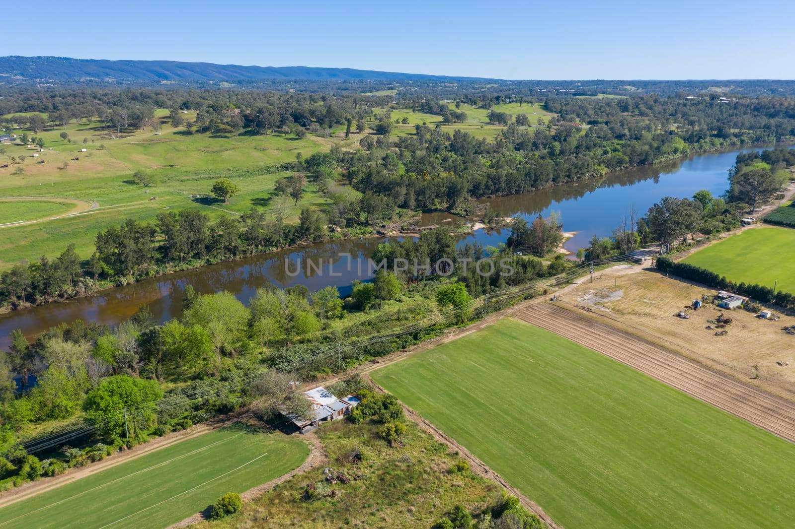 Aerial view of the Hawkesbury River and farmland in regional New South Wales in Australia by WittkePhotos