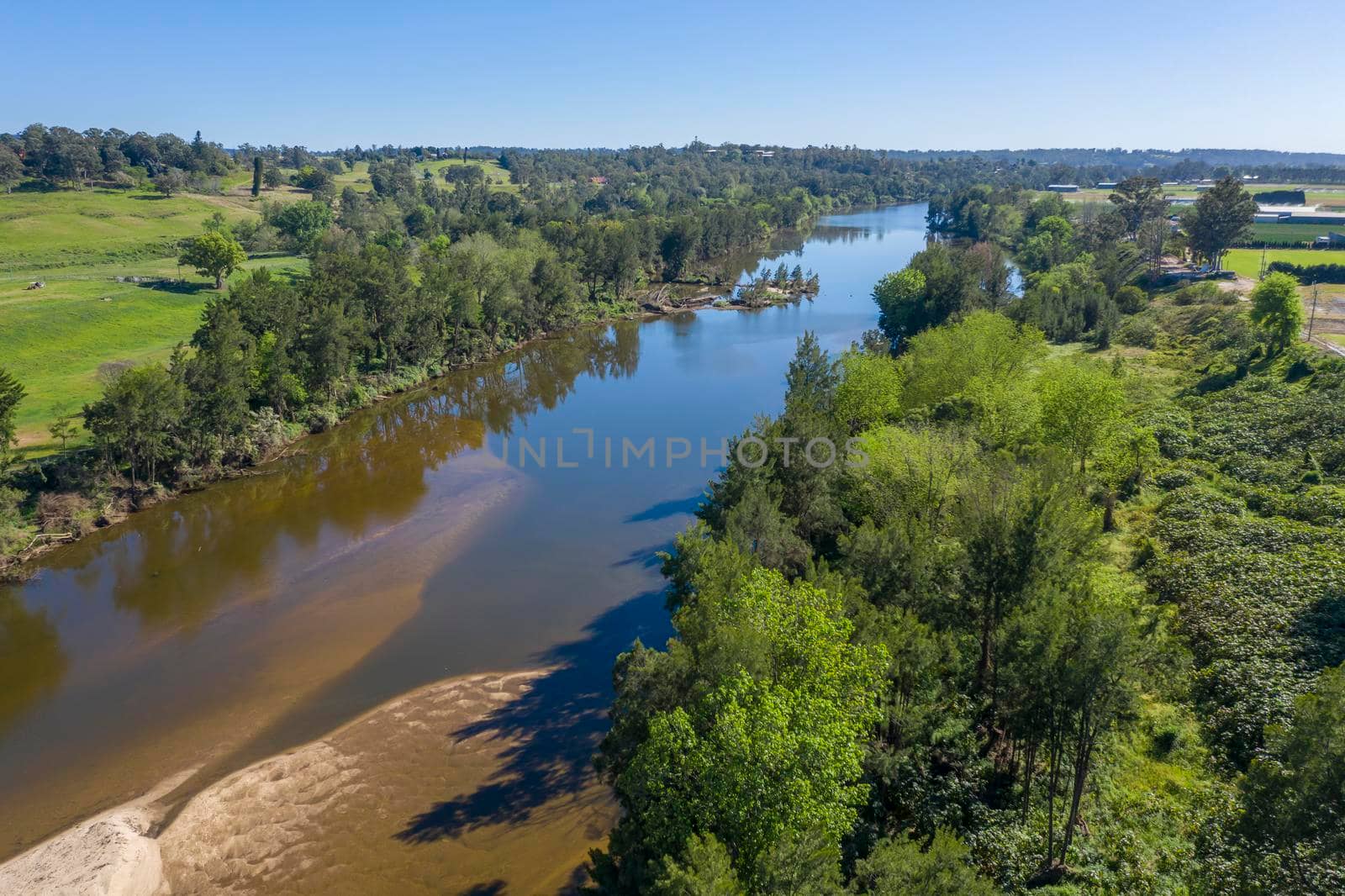 Aerial view of the Hawkesbury River and farmland in regional New South Wales in Australia by WittkePhotos